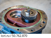 Close up of gearbox showing rotating gears and mechanical components. Стоковое фото, фотограф Юрий Поздников / Фотобанк Лори
