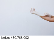 Female hands wearing disposable gloves. Стоковое фото, фотограф Акимова Надежда / Фотобанк Лори