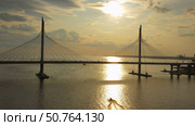 Cable-stayed bridge and new skyscraper at sunset. Стоковое фото, фотограф Михаил Коханчиков / Фотобанк Лори