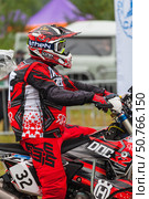 ANGARSK, IRKUTSK REGION, RUSSIA - July 13, 2025: XV International Silk Way Rally, motorcycle competition. Race on high-speed special stage in Angarsk. Participant No.32 Shcheglov Ilya at start. Редакционное фото, фотограф Виктория Катьянова / Фотобанк Лори
