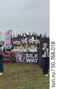 ANGARSK, IRKUTSK REGION, RUSSIA - July 13, 2025: XV International Silk Way Rally, racing competition.Vertical video of group of beautiful drummers girls perform on open stage before start of motor rally. Редакционное видео, видеограф Виктория Катьянова / Фотобанк Лори