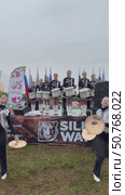 ANGARSK, IRKUTSK REGION, RUSSIA - July 13, 2025: XV International Silk Way Rally, racing competition.Vertical video of group of beautiful drummers girls perform on open stage before start of motor rally. Редакционное видео, видеограф Виктория Катьянова / Фотобанк Лори