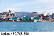 Old harbour seaside view featuring vibrant buildings, Reykjavik, Iceland (2017 год). Редакционное фото, фотограф EugeneSergeev / Фотобанк Лори