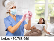 Doctor in mask and gloves with syringe. Стоковое фото, фотограф Яков Филимонов / Фотобанк Лори