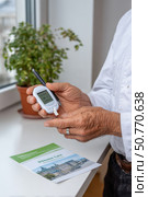 Doctor measuring blood glucose level with glucometer for patient healthcare. Стоковое AI-изображение, AI-художник Юрий Поздников / Фотобанк Лори