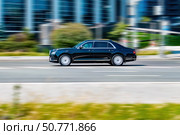 Aurus Senat automobile driving fast on city streets. Редакционное фото, фотограф Константин Григорьев / Фотобанк Лори