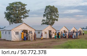 Refugees waiting in line at a makeshift clinic. Стоковое AI-видео, аниматор Юрий Поздников / Фотобанк Лори