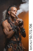 Indigenous man performing a ritual with smoke. Стоковое AI-видео, аниматор Юрий Поздников / Фотобанк Лори