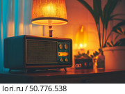 A vintage 1970s retro radio featuring large dials and an old-school design, illuminated by warm lighting. This classic music player exudes nostalgic charm and timeless style,  created by ai. Стоковое AI-изображение, AI-художник Виталий Сова / Фотобанк Лори