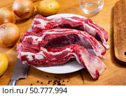 Raw beef brisket served at table. Стоковое фото, фотограф Яков Филимонов / Фотобанк Лори