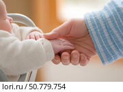 A Heartwarming Moment: Tender Interaction Between a Parent and Their Baby with Soft Features in a Warm, Inviting Environment. Стоковое AI-изображение, AI-художник Башкирова Анна / Фотобанк Лори
