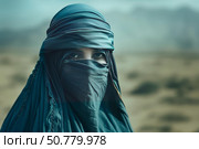 Muslim woman wearing niqab and hijab in desert environment. Стоковое AI-изображение, AI-художник Иван Рябоконь / Фотобанк Лори