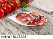 Italian Cured pork neck slices. Стоковое фото, фотограф Андрей Старостин / Фотобанк Лори