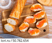 Sandwiches with butter and salted salmon on wooden board. Стоковое фото, фотограф Яков Филимонов / Фотобанк Лори