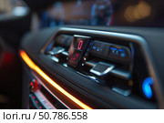 Modern car interior showing climate control and infotainment system. Стоковое AI-изображение, AI-художник Иван Рябоконь / Фотобанк Лори