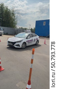 Moscow Russia  June 15 2025 Driving school Training for a parallel parking exam concept.Modern car on driving school test track with traffic cones.Driver training area with parked cars. Редакционное видео, видеограф Zita Khasanova / Фотобанк Лори