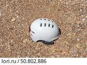 A white helmet on the orange and yellow stones background. Стоковое фото, фотограф Татьяна Куклина / Фотобанк Лори