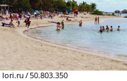 Dominican Republik, Punta Cana. Animators on the beach conduct gymnastics for tourists in the sea. Sports in the open air. Редакционное видео, видеограф Anna Scherbina / Фотобанк Лори