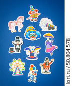 Novosibirsk, Russia - March 1, 2025: Cartoon style vinyl stickers featuring colorful circus characters and animals on a bright blue background. Редакционное фото, фотограф Виталий Сова / Фотобанк Лори