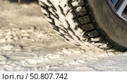 A car on a winter studded road on a snowy road. Стоковое фото, фотограф Igor Skripachev / Фотобанк Лори