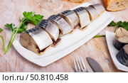 Slices of lightly salted mackerel fish served with  greens. Стоковое фото, фотограф Яков Филимонов / Фотобанк Лори