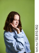 Teen Girl Model Showcases Creativity With a Playful Pose and Bold Expression in a Studio Setting. Стоковое фото, фотограф Aleksandr Golubev / Фотобанк Лори