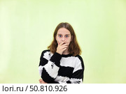 Teen Actress Expresses Surprise and Curiosity Indoors, Capturing a Moment of Raw Emotion. Стоковое фото, фотограф Aleksandr Golubev / Фотобанк Лори
