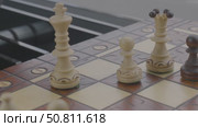 Hand of man moving a chess piece on a board. Стоковое видео, видеограф Дмитрий Нечаев / Фотобанк Лори