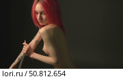 Beauty shoot with model in studio setting showcasing striking tattoos. Стоковое видео, видеограф Гурьянов Андрей / Фотобанк Лори