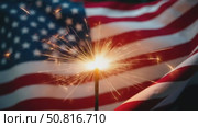 Sparklers and american Flag. Independence day USA . Celebration 4th of July - Patriotic Holiday. Стоковое AI-видео, аниматор Sergey Grishin / Фотобанк Лори