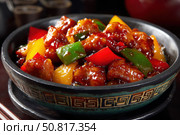 Sweet sour pork with colorful peppers, mixed vegetables served in a black bowl on dark concrete background. Traditional Chinese dish. Close-up. The meat pieces in a brown sauce glaze. Sichuan cuisine. Стоковое AI-изображение, AI-художник Марина Демидюк / Фотобанк Лори