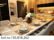 Elegant Dining Experience with Exquisite Table Setting Featuring Stylish Dinnerware and Modern Kitchen Ambience. Стоковое фото, фотограф Башкирова Анна / Фотобанк Лори