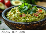 Deliciously Creamy Avocado Guacamole with Fresh Ingredients, Perfectly Seasoned and Garnished with Cilantro, Ideal for Dips and Spreads. Стоковое AI-изображение, AI-художник Башкирова Анна / Фотобанк Лори