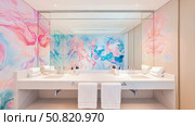 Modern Double Vanity with Marble Accents and Artistic Backsplash for Interior Magazine. Стоковое AI-изображение, AI-художник Данила Большаков / Фотобанк Лори