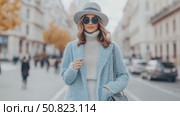 Chic Woman in Light Blue Coat Striding Cityscape. Стоковое AI-видео, аниматор Данила Большаков / Фотобанк Лори