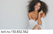 Radiant Smile: woman's joyful portrait wrapped in white. Стоковое AI-видео, аниматор Данила Большаков / Фотобанк Лори