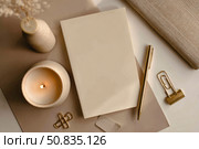 Back to life, goal list concept. Woman's hand writing in empty notebook on wooden table. Resolutions, plan, goals, checklist, idea concept. Top view, flat lay, copy space. 2026. Christmas, New Year. Стоковое AI-изображение, AI-художник Марина Демидюк / Фотобанк Лори