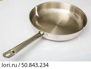 Small metallic frying pan with long handle. Стоковое фото, фотограф Яков Филимонов / Фотобанк Лори