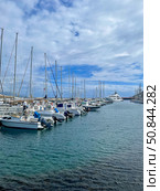 Faial island, Portugal - September 23, 2023: Sailboats docked at Horta Marina on Faial Island, Azores. Редакционное фото, фотограф Софья Соломонова / Фотобанк Лори