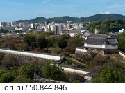 View from the observation deck of Himeji Castle ("Castle of the White Heron" or "Castle of the White Herons") of the city and the castle grounds, Himeji, Hyogo Prefecture, Japan. Стоковое фото, фотограф Ula Ulachka / Фотобанк Лори