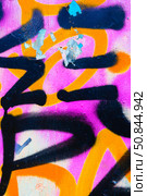 Graffiti Art with Bold Black, Orange, Pink for Urban 2000s Y2K Vibe. Стоковое фото, фотограф Александра Конопля / Фотобанк Лори