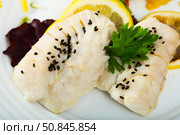 Closeup of  codfish steamed and served with herbs and lemon. Стоковое фото, фотограф Яков Филимонов / Фотобанк Лори