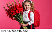 Cute first grader with ponytails on her head. In her hands is a bouquet of autumn gladioli flowers. The child goes to school for the first time. Bright background. Стоковое AI-изображение, AI-художник Ирина Гильмуллина / Фотобанк Лори