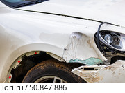 Broken car after a crash. Damaged wing and headlamp of a car, scratches on a car body. Стоковое фото, фотограф Емельянов Евгений Викторович / Фотобанк Лори