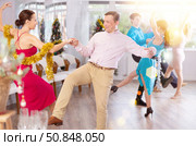 Incendiary paso doble dance during Christmas or New Year celebrations in dance studio. Стоковое фото, фотограф Яков Филимонов / Фотобанк Лори