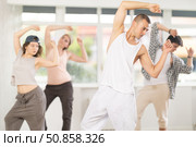 Young guy practicing basic hip hop moves in training hall. Стоковое фото, фотограф Яков Филимонов / Фотобанк Лори