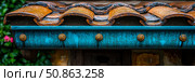 Weathered Charm: Close-up of Turquoise Eavestrough with Rustic Tiles, Evoking Timeless Architectural Art. Стоковое AI-изображение, AI-художник Данила Большаков / Фотобанк Лори
