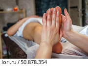 Natural medicine, reflexology, woman receiving foot massage, oppresses energy flow points, spa center calm interior. Стоковое фото, фотограф Владислав Тригуб / Фотобанк Лори