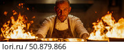Intense cuisine: A chef's fiery realm for preparing culinary mastery with burning flames, for a food blog promotion. Стоковое AI-изображение, AI-художник Данила Большаков / Фотобанк Лори