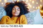 Serene Sleep: A woman enjoys restful sleep amidst soft light, embodying calm and relaxation for a peaceful moment of escape. Стоковое AI-изображение, AI-художник Данила Большаков / Фотобанк Лори